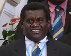 John Dean Kuku poses for an official photo as part of the delegation led by Solomon Islands Prime Minister Manasseh Sogavare (26 September 2017) in Taipei, Taiwan