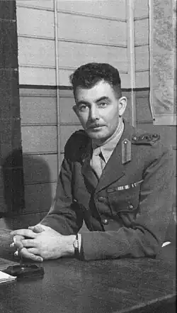 O'Brien in uniform sitting at a desk