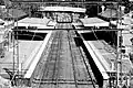 Black and white image of Jolimont station. Westbound view of Jolimont station platforms and buildings, February 2013