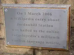 commemorative plaque reading "On 1 March 2006 a Wikipedia entry about Jordanhill Station was hailed as the online encyclopedia's millionth English-language article."