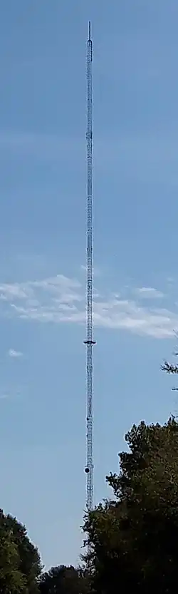 A tall, guyed TV tower