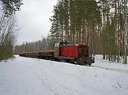 Locomotive TU7-1231 with freight train