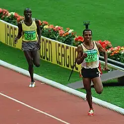 Image 32Ethiopian runner Kenenisa Bekele leading in a long-distance track event (from Track and field)