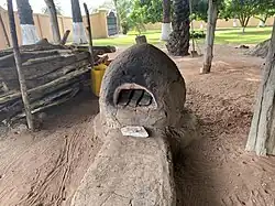 Traditional glass bead making workshop, front view of empty kiln for heating recycled glass.