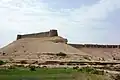 The fort sits atop a natural mound.