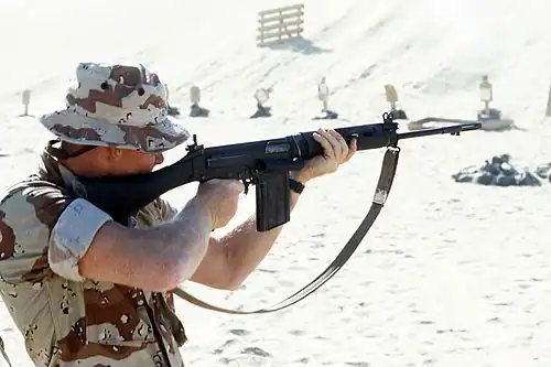 A United States Marine with a British L1A1 SLR, during a training exercise as part of the Gulf War's Operation Desert Shield