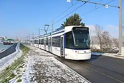 Seven-section blue and white tram