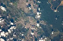 Satellite image showing Coronel Fabriciano (center of the image) and parts of Ipatinga (above) and Timóteo (below).