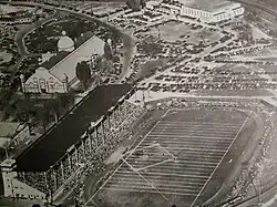Black and white aerial view of a football stadium with the surrounding exhibition grounds