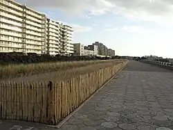 A photo with high-rise buildings near a beach