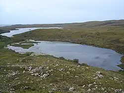 Loch an Fheoir is part of a chain of lochs, including Loch An T-Slagain, that flows into Slaggan Bay.