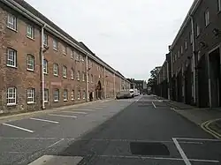 Double Ropery (left, 1771-5) and associated storehouses (right, 1771–81). Between them is Anchor Lane, where anchors were formerly stored in the open air until required.