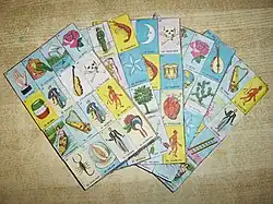 Five lotería boards arranged in a fan