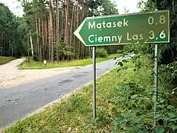 A fingerpost pointing to the village