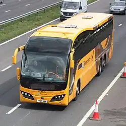 Photograph of the South West Falcon coach on the M5 motorway sporting new yellow livery