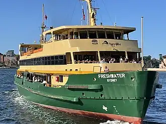 Freshwater departs Circular Quay displaying her opened upper deck seating areas; these were opened in the early 2000s.