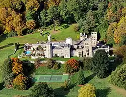 aerial view of a country house within parkland