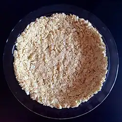 Saltines and butter are pressed into a pie pan