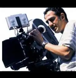 Hüseyin using a camera to film