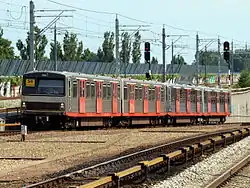 A former LHB M3 train in the original color combination with orange doors near Holendrecht (2009)