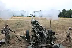 Michigan ANG soldiers fire a 155 mm M777 Howitzer, at the Camp Grayling Joint Maneuver Training Center during Exercise Northern Strike 2016