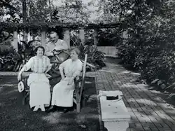 This photo shows Milton Hershey (back) with Catherine (left)