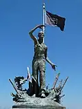 Liberation statue with POW flag