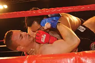 Image 26Groundfighting in MMA. Differently from other grappling-based martial arts, you are allowed to strike your opponent when fighting on the ground. (from Mixed martial arts)