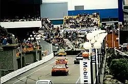 Photo of car racing along promenade