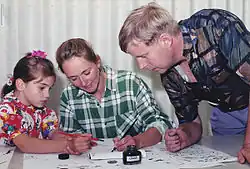 A mother and daughter learn calligraphy together, 2013.