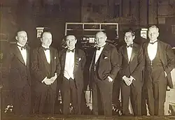 Six men in evening dress
