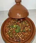 Traditional Algerian tajine mtewem served in a tajine pot in Algiers, Algeria
