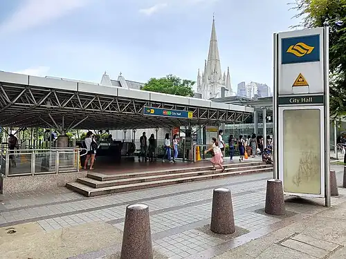 Photograph of the station entrance at ground level, with St Andrew's Cathedral in the background