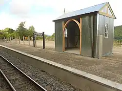 The new platform at Nantyronen railway station still under construction in 2013, with the new station building, yet to be painted.