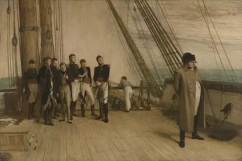 A group of men in military uniform and formal clothes stand to the left, looking towards a single man in a greatcoat and bicorne hat stood by the rail of a ship looking out to sea