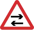 B22: Two-way traffic crosses one way road