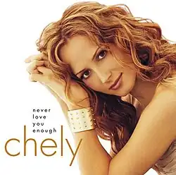 A woman's head and arms are visible, leaning toward the left of the image. The text "Chely Wright" and "Never Love You Enough" appears in the lower left corner.