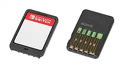 On the left, the front of a Nintendo Switch Game Card is seen. To the right, the bottom of a Nintendo Game Card is seen.