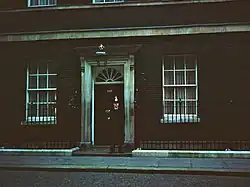 A dim shot of the door of 10 Downing Street