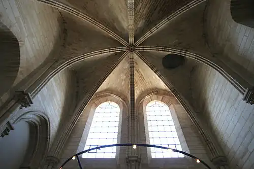 Circular utility door (right of center) in the ceiling below the north tower made for raising and lowering bells[153]