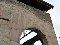 stucco wall in south-west corner of palaestra