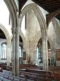 Interior of All Saints' Church; view from north aisle looking southwest towards font