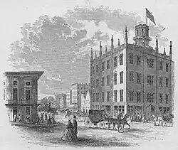 Black and white illustration of the facade of the Ohio Mechanics' Institute, with pedestrians and horse-drawn carriages