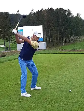 Golfer with baseball cap