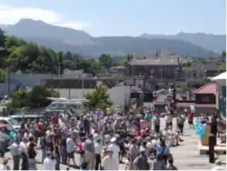 Aerial view of a large crowd listening to a speech