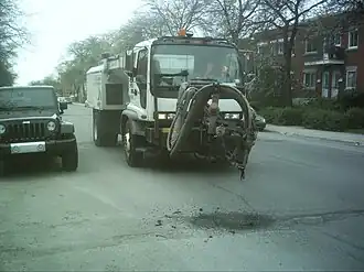 Spray-injection device for pothole repair—all-in-one repair unit in Montreal, which allows the operator to work from the comfort and safety of the cab