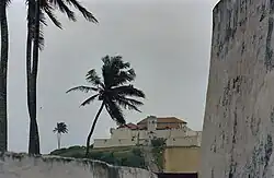 Faraway view of Fort Coenraadsburg on a hill