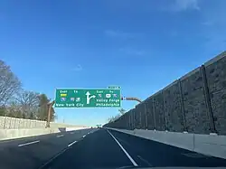 Three lanes in the same direction, with two signs