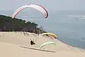 Paragliders above the dune