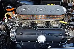 Type 128D Colombo 3.0-litre V12 engine. Twin distributors and three Weber carburettors visible.